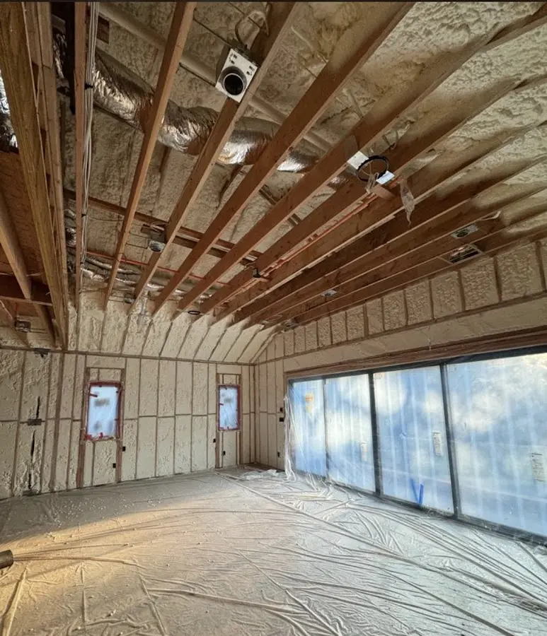Interior walls and ceiling insulated with spray foam during new construction in Jamestown